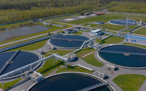 Aerial view of the wastewater treatment plant. Pumping station and drinking water supply. Industrial and urban water treatment for a big city. Round sedimentation tanks.